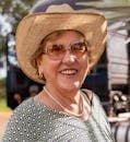 pexels-photo-31206469-31206469 Cheerful senior woman wearing a sun hat and sunglasses outside in rural Brazil.